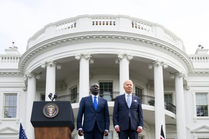 US President Joe Biden (R) and Kenya's President William Ruto stand as national anthems ar