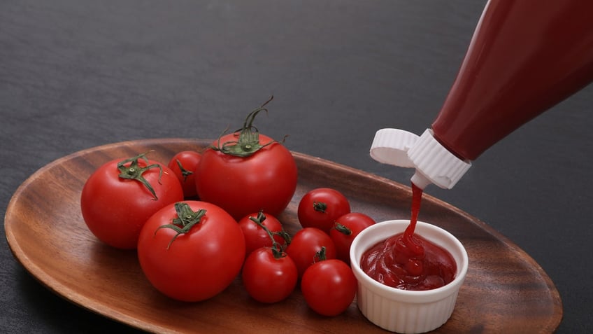 Ketchup squeezed into cup.