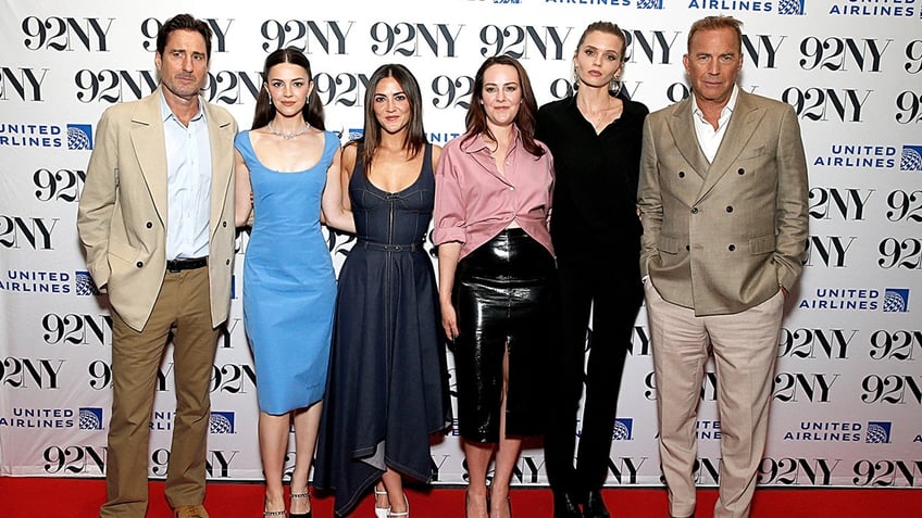 The cast of "Horizon: An American Saga" including Luke Wilson, Ella Hunt, Isabelle Fuhrman, Jena Malone, Abbey Lee and Kevin Costner poses on the carpet