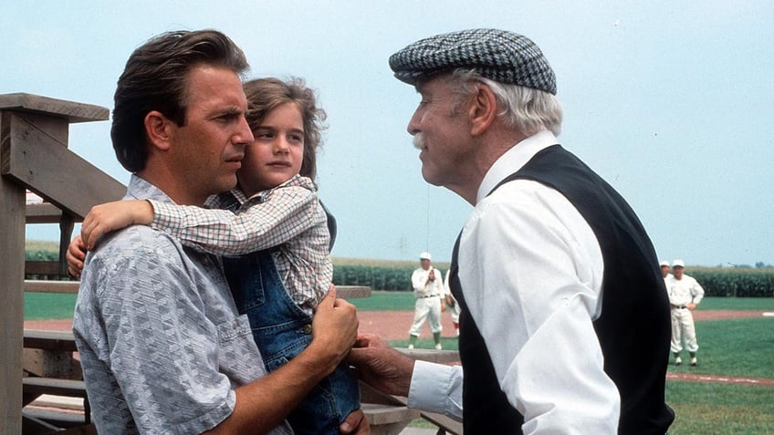 Kevin Costner, Gaby Hoffman and Burt Lancaster in a scene from "Field of Dreams"
