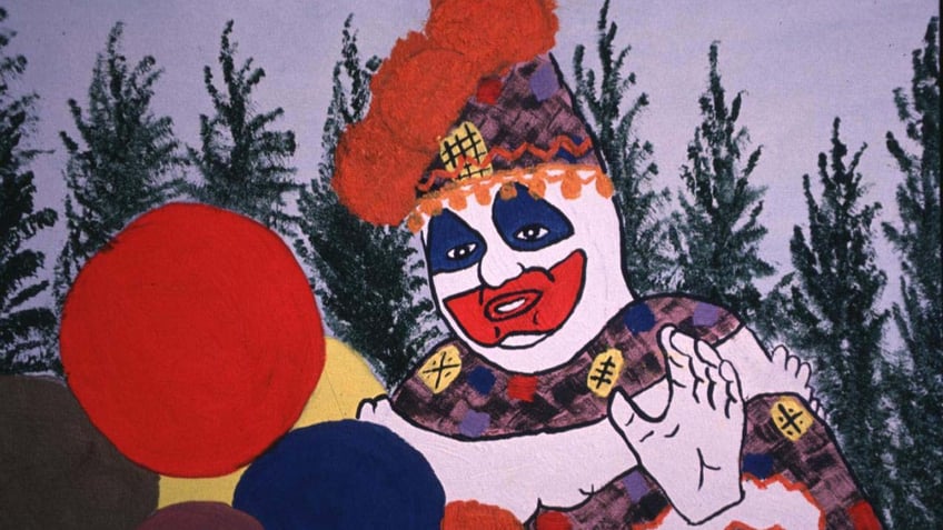 A photo of John Wayne Gacy's painted self-portrait in clown costume