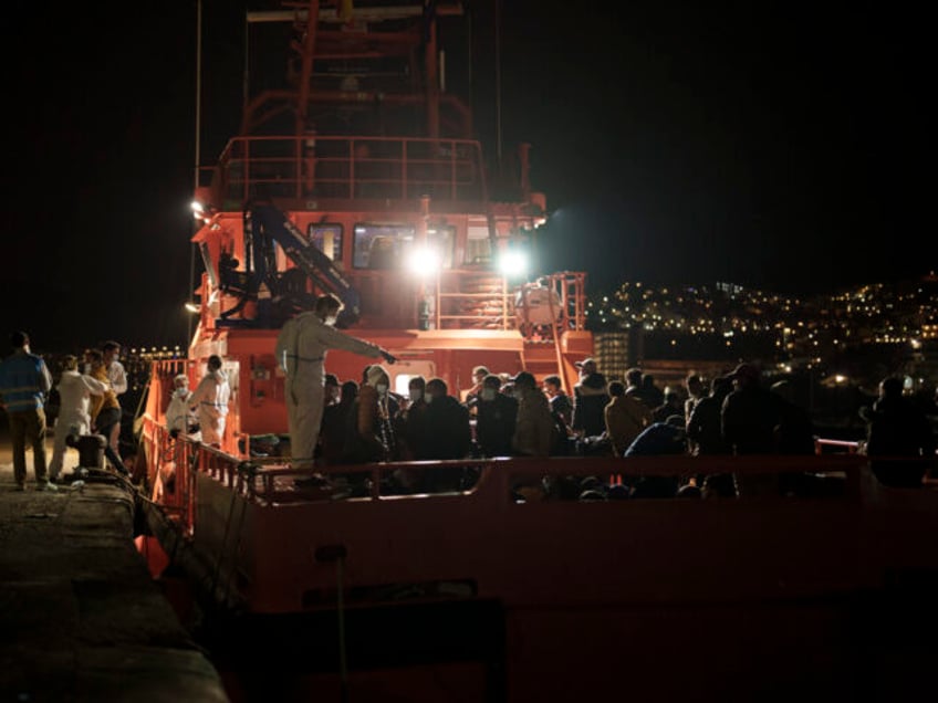 Migrants arrive aboard a Spanish coast guard rescue ship at Arguineguin port, in Gran Cana