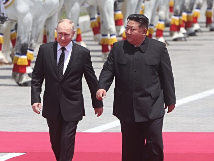 PYONGYANG, NORTH KOREA- JUNE 19 (RUSSIA OUT) Russia's President Putin (L) and North Korean