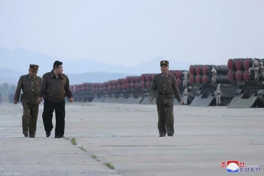 kim jong un oversees massive missile launch preemptive attack drills