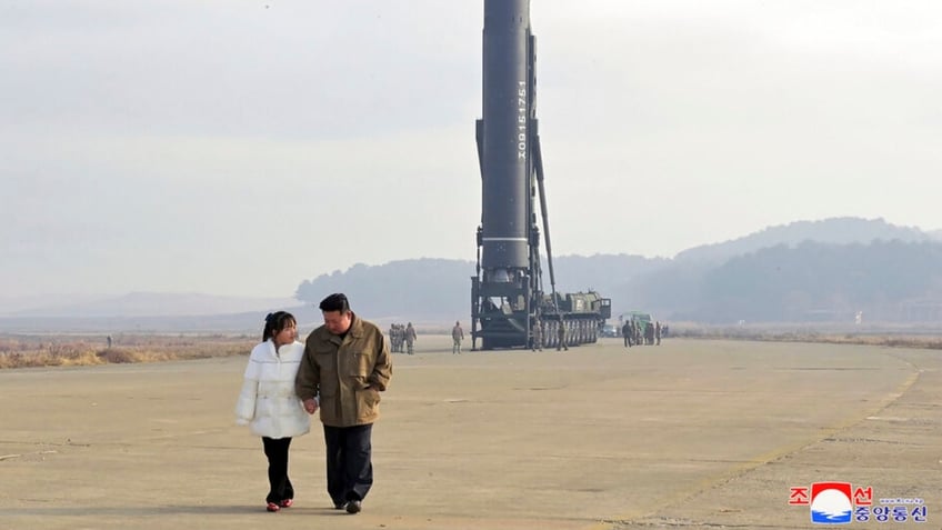 kim jong un publicizing daughter to secure loyalty for family south korean officials speculate