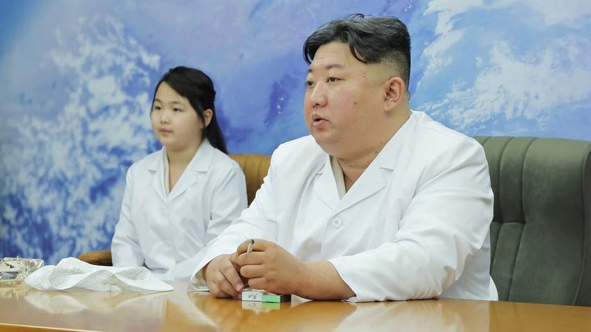 kim jong un publicizing daughter to secure loyalty for family south korean officials speculate