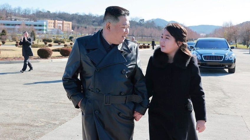 kim jong un publicizing daughter to secure loyalty for family south korean officials speculate