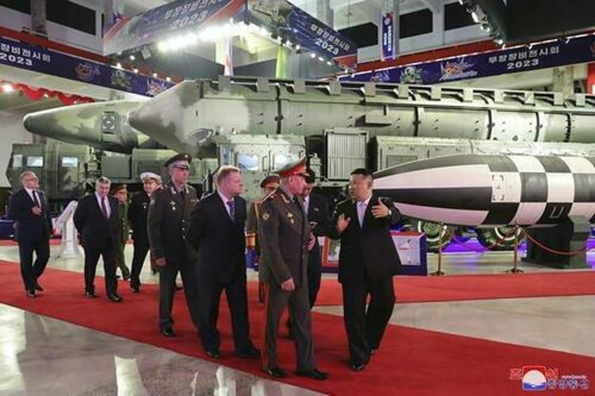 kim jong un shows off banned missile arsenal to russian defense chief shoigu