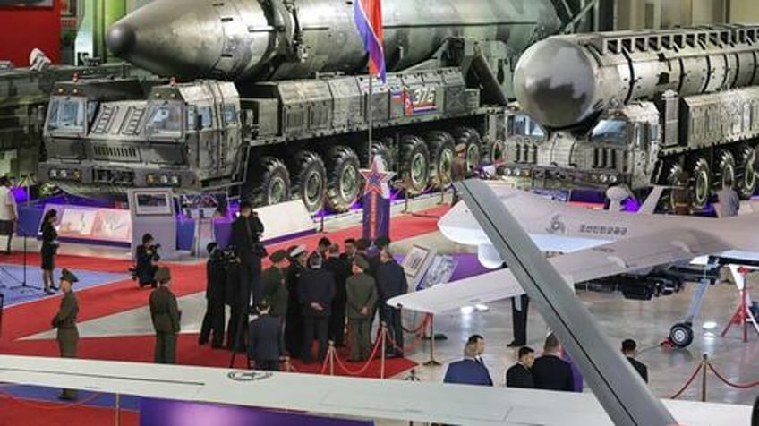kim jong un shows off banned missile arsenal to russian defense chief shoigu