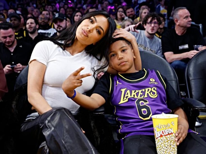 LOS ANGELES, CALIFORNIA - MARCH 16: Kim Kardashian and Saint West attend a basketball game