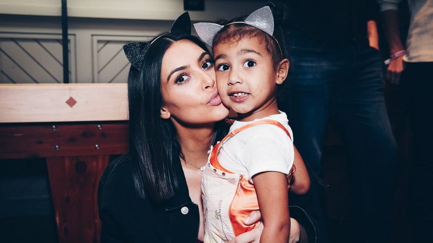 Kim Kardashian with North West as a baby