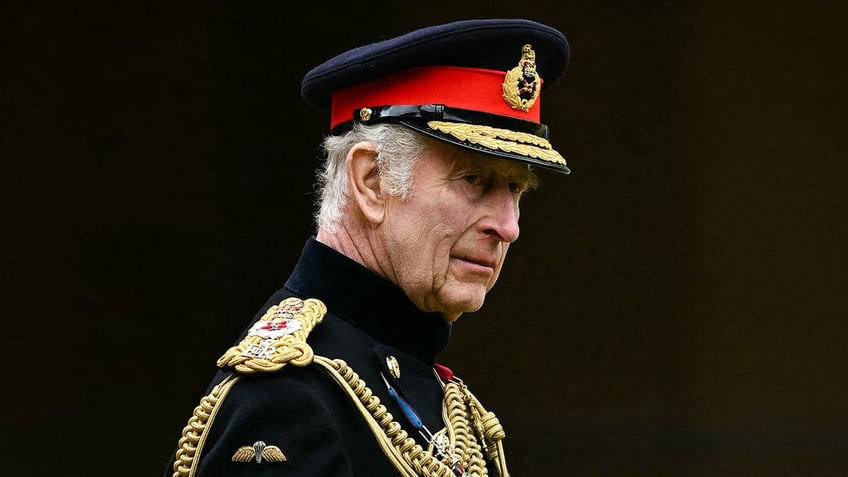 King Charles in a military uniform looking serious.