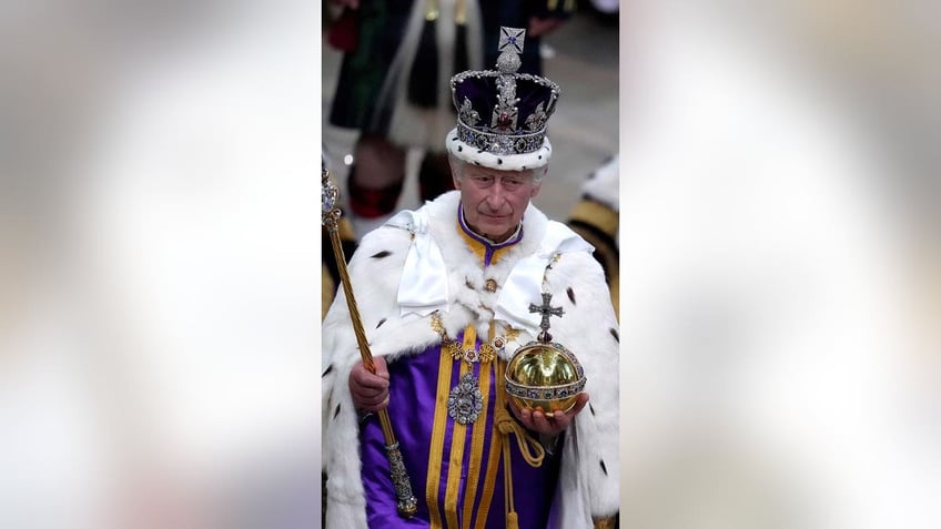 Britains King Charles III walks in the Coronation Procession
