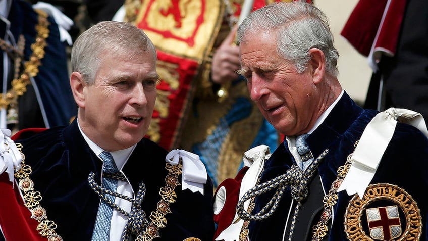 A close-up of Prince Andrew chatting with King Charles in royal robes.