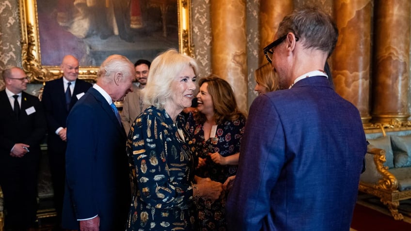 queen camilla smiling at kenneth yeo