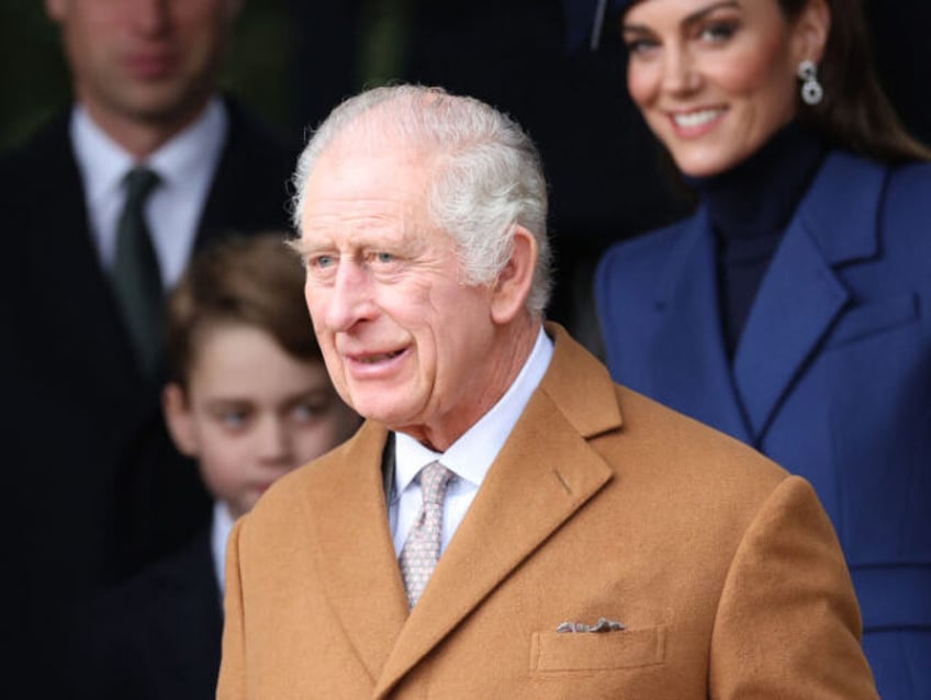 Britain's King Charles III waits on the church steps after attending the Royal Family's traditional Christmas Day service at St Mary Magdalene Church on the Sandringham Estate in eastern England, on December 25, 2023. (Photo by Adrian DENNIS / AFP) (Photo by ADRIAN DENNIS/AFP via Getty Images)