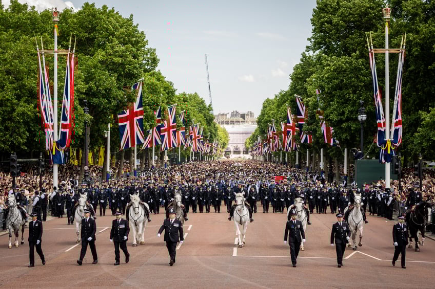 Members of the public line up on the Mall, London, to view the flypast following, the Trooping the Colour ceremony in central London, as King Charles III celebrates his official birthday. Picture date: Saturday June 14, 2025. (Photo by Aaron Chown/PA Images via Getty Images)
