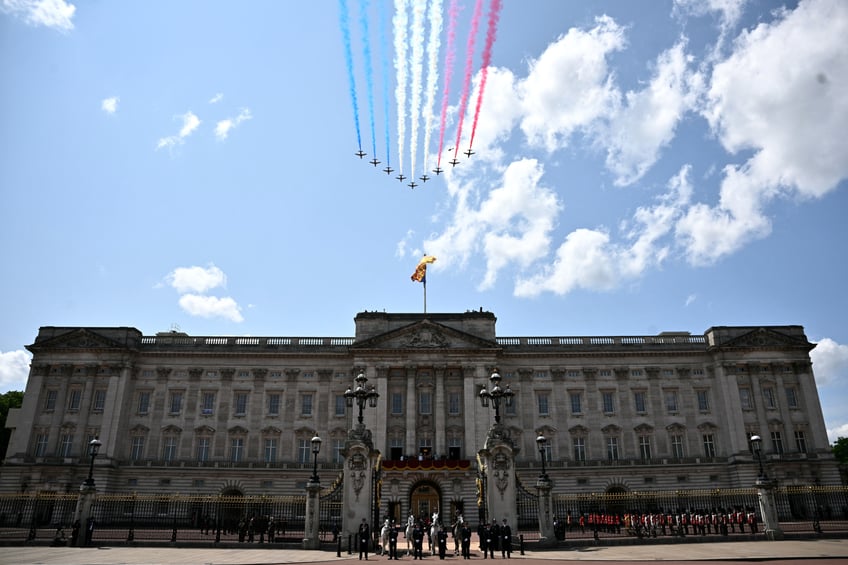 British Royal Air Force's (RAF) aerobatic team, the "Red Arrows" perform a flypast over Buckingham Palace during the King's Birthday Parade "Trooping the Colour" in London on June 14, 2025. The ceremony of Trooping the Colour is believed to have first been performed during the reign of King Charles II. Since 1748, the Trooping of the Colour has marked the official birthday of the British Sovereign. Over 1500 parading soldiers and almost 300 horses take part in the event. (Photo by Ben STANSALL / AFP) (Photo by BEN STANSALL/AFP via Getty Images)