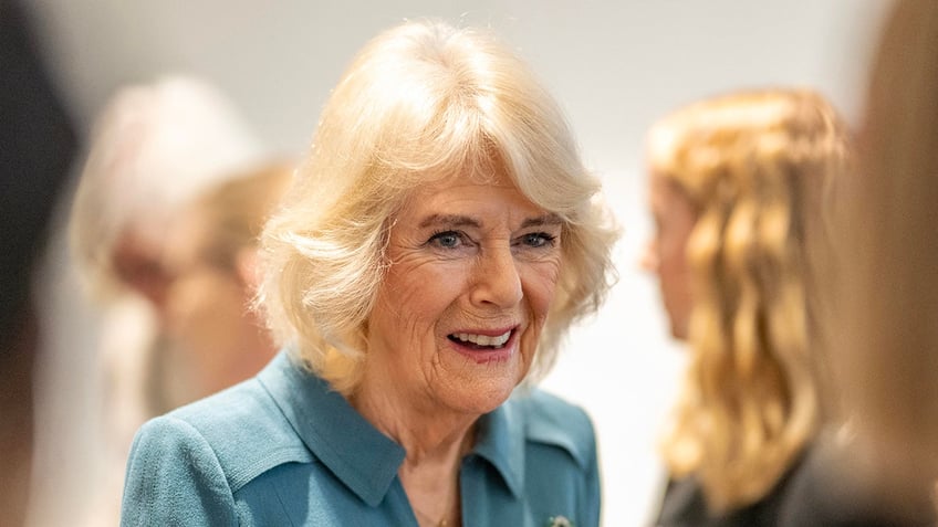 A close-up of Queen Camilla talking to people at a public function