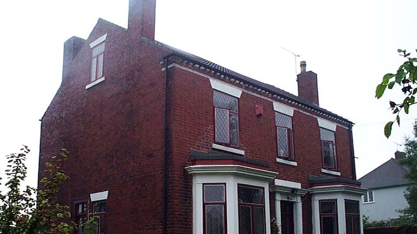 An aerial view of a red brick house.