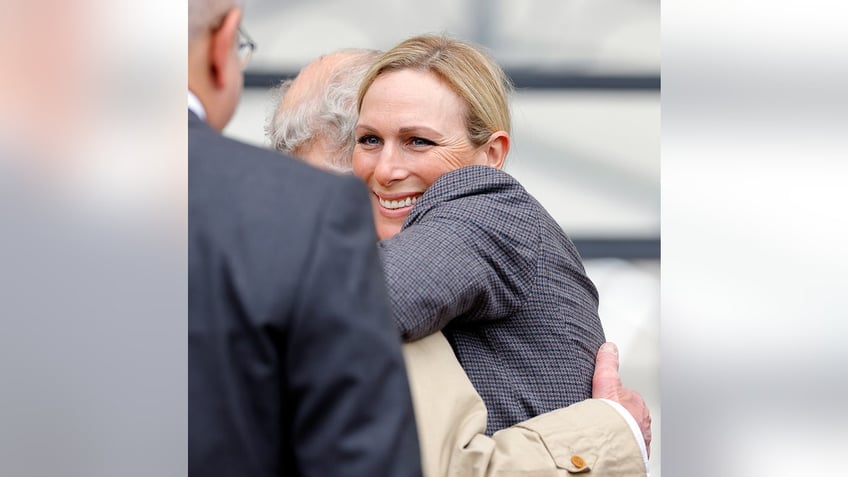 Zara Phillips hugging her uncle King Charles