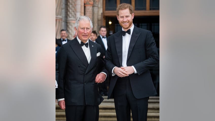 Prince Harry standing with King Charles