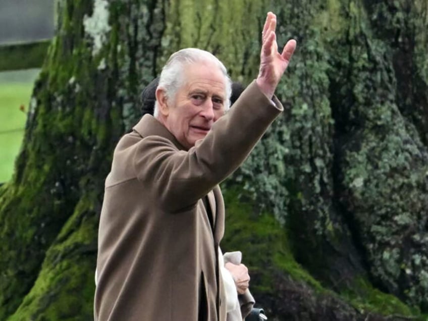 Britain's King Charles III and Britain's Queen Camilla (hidden) arrive at St Mary Magdalen