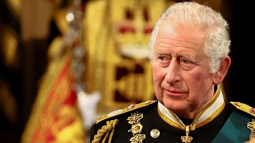 A close-up of King Charles in formal wear with medals.