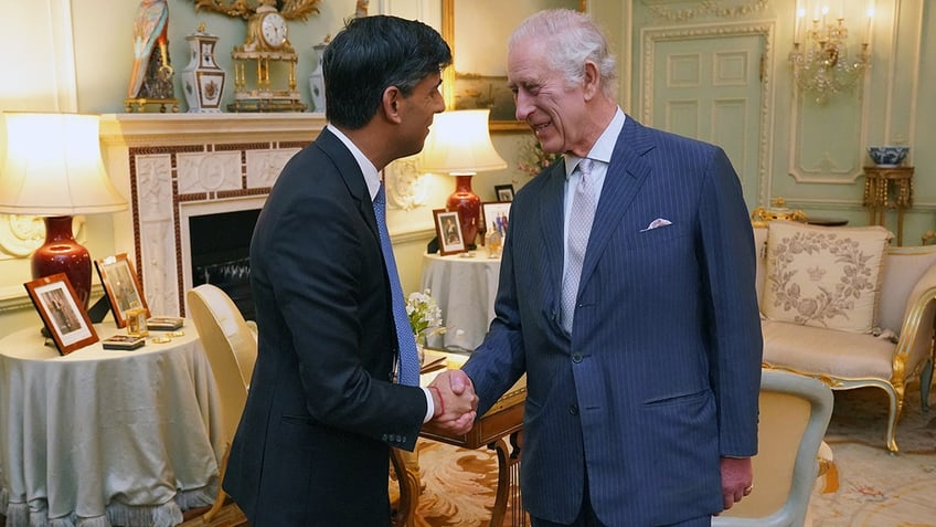 King Charles shakes Prime Minister Sunak's hand