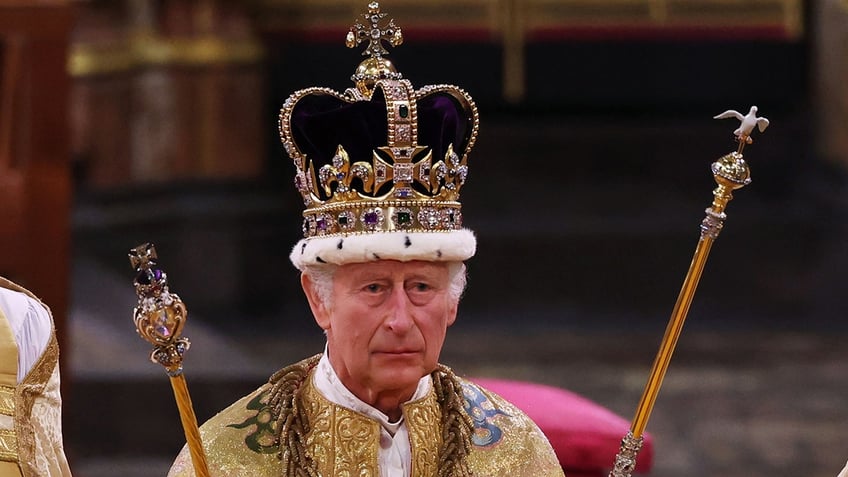 A close-up of King Charles wearing his crown