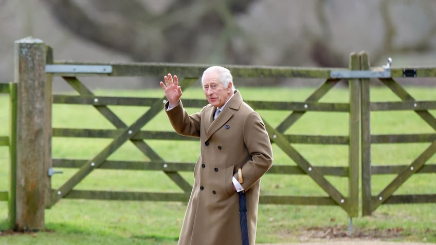 king charles waving while walking at sandringham house 