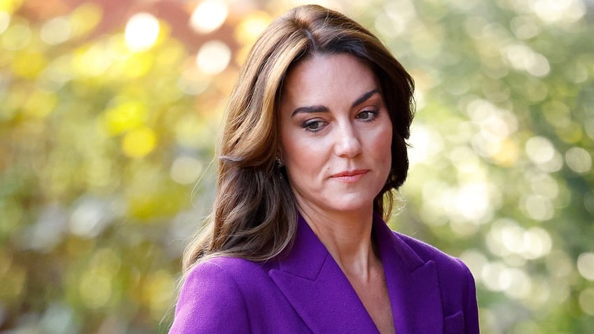 Kate Middleton looks down