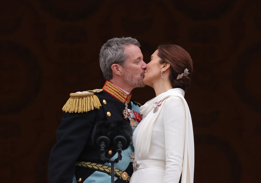 COPENHAGEN, DENMARK - JANUARY 14: Danish King Frederik X and Queen Mary kiss on the balcony of Christiansborg Palace shortly after his proclamation on January 14, 2024 in Copenhagen, Denmark. King Frederik X is succeeding Queen Margrethe II, who has stepped down after reigning for 51 years. (Photo by Sean Gallup/Getty Images)