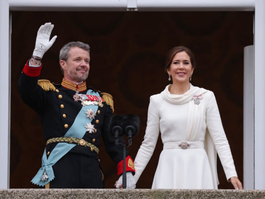 COPENHAGEN, DENMARK - JANUARY 14: Danish King Frederik X waves as he stands with Queen Mary on the balcony of Christiansborg Palace shortly after his proclamation on January 14, 2024 in Copenhagen, Denmark. King Frederik X is succeeding Queen Margrethe II, who has stepped down after reigning for 51 years. …