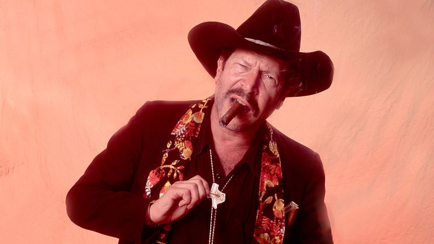 Kinky Friedman smoking a cigar