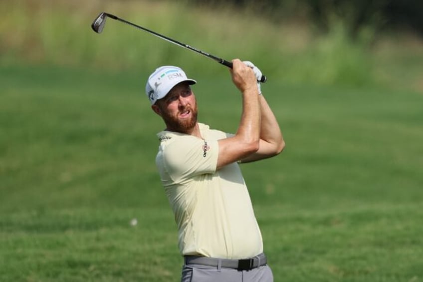 American Chris Kirk aced the par-3 14th hole on his way to firing a six-under par 64 for a