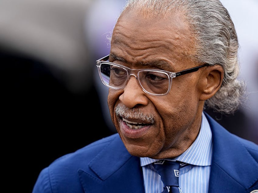 Al Sharpton waits for Vice President Kamala Harris to speak before walking across the Edmu