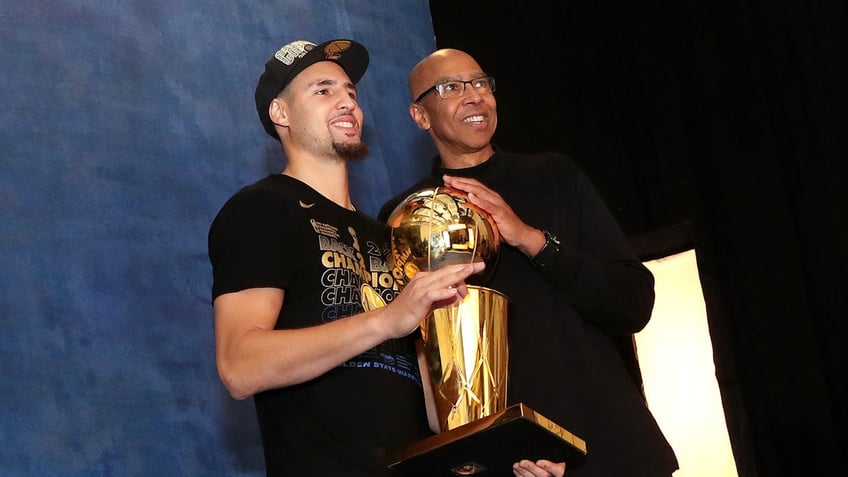 Klay and Mychal Thompson with NBA Trophy