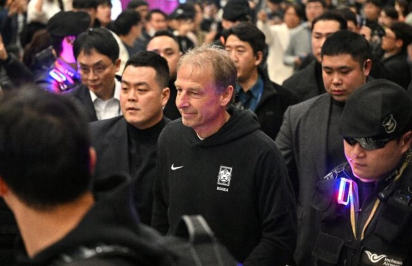 Jurgen Klinsmann pictured arriving back in South Korea last week following their Asian Cup