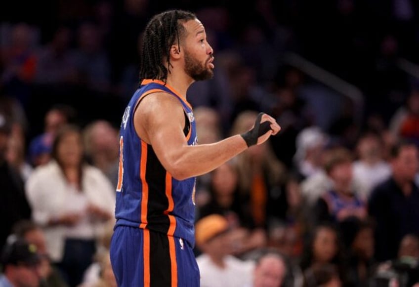 Jalen Brunson of the New York Knicks directs his teammates in the final minute of their ov