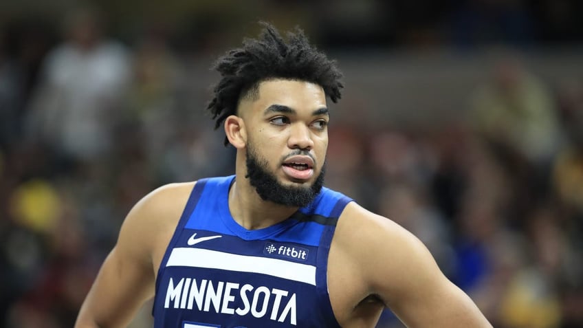 Karl Anthony-Towns wearing a blue jersey