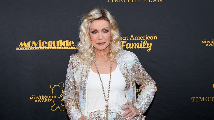 Donna Mills posing on the red carpet