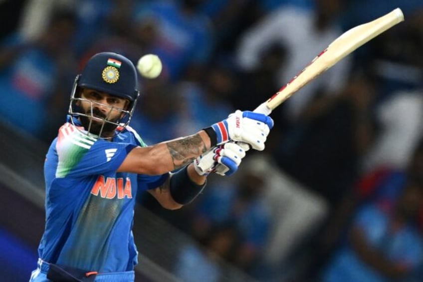 Shutting out the 'noise': India's Virat Kohli hits the winning boundary and completes his