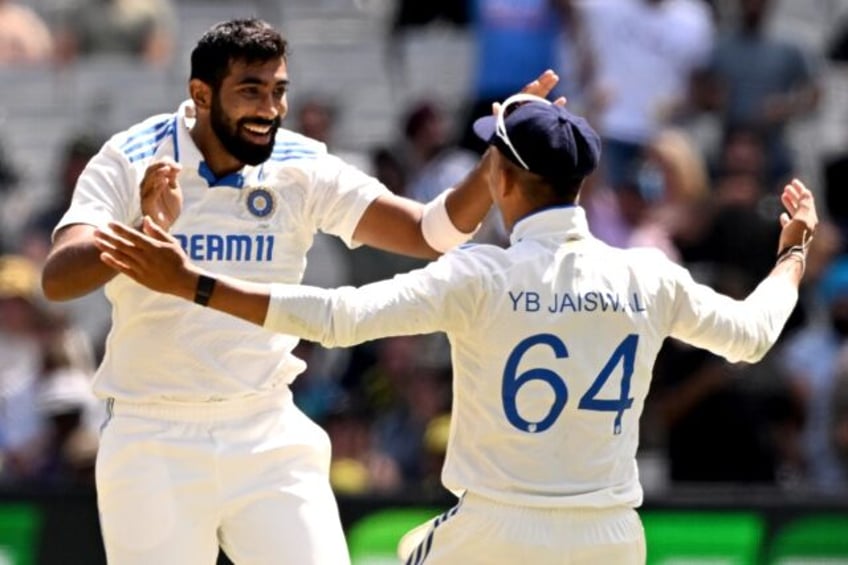 India bowler Jasprit Bumrah (lfet) celebrates with teammate Yashasvi Jaiswal after dismiss