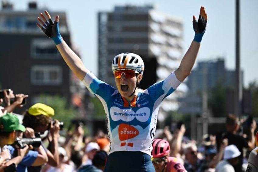 Dutch rider Charlotte Kool celebrates her first stage win in the women's Tour de France wh