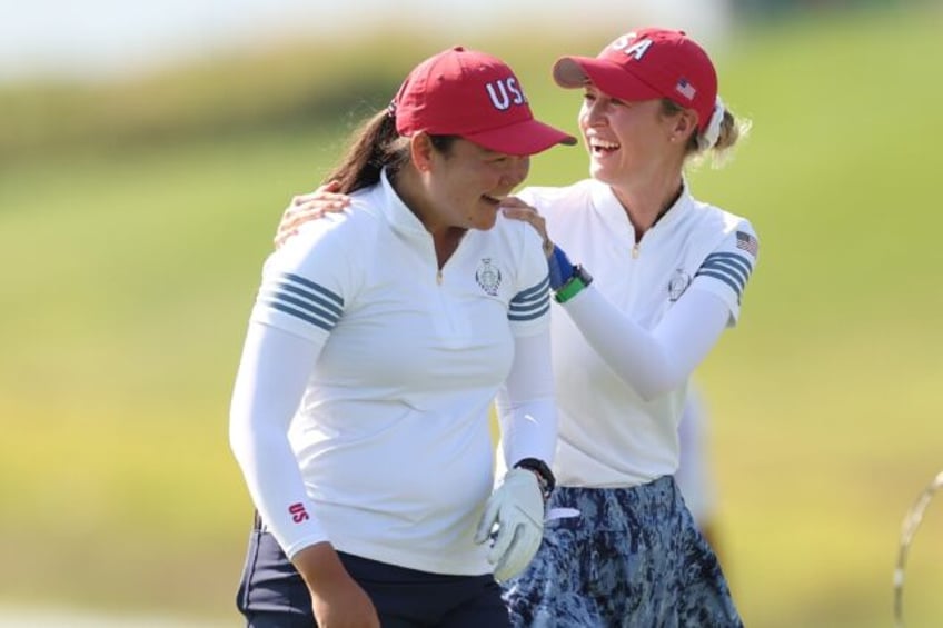 Top-ranked Nelly Korda, right and Allisen Corpuz celebrate a Korda eagle putt as the US du