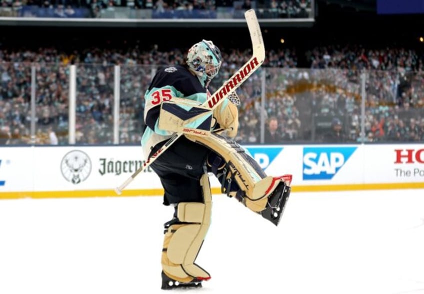 Seattle goaltender Joey Daccord celebrates after a 3-0 shutout victory over Vegas in the NHL Winter Classic outdoor game