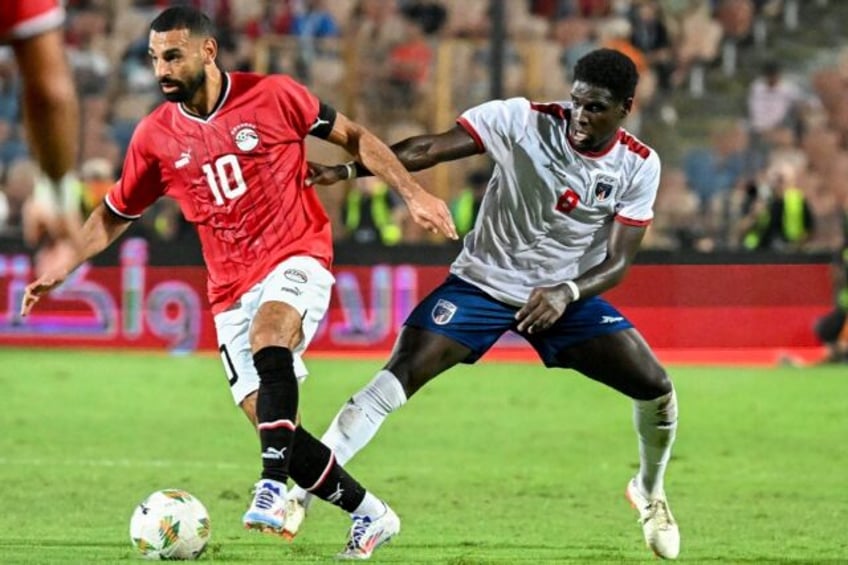 Mohamed Salah (L) eludes Cape Verde's Joao Paulo Fernandes as Egypt won 3-0 in Africa Cup