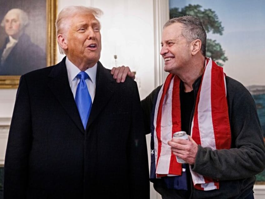 US President Donald Trump, left, and US schoolteacher Marc Fogel, who had been detained in