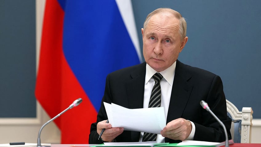 kremlin shortens quarantine before meeting putin as presidential elections approach